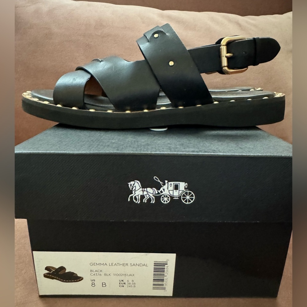 Coach Gemma leather sandal with gold rivet detail.